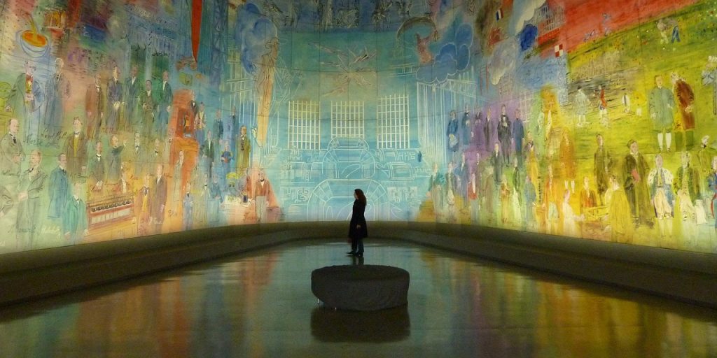 Beautiful art projected across all walls in a museum. 